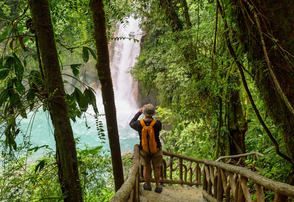 Majestic waterfall in the rainforest jungle of Costa Rica. Tropi